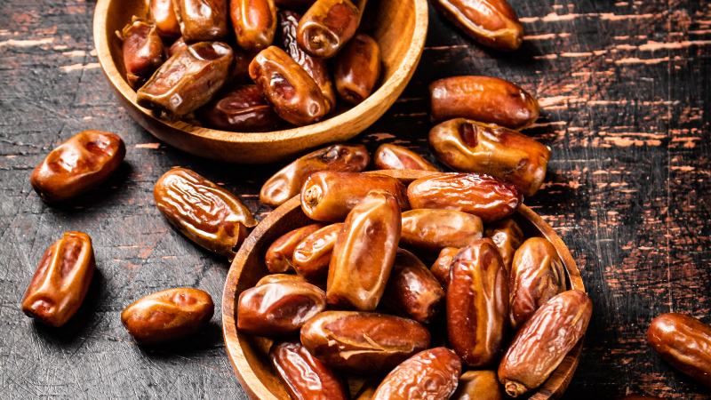  Two wooden bowls filled with dates