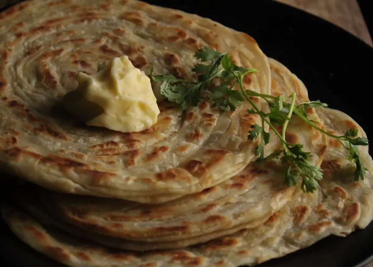 Freshly made parathas with butter for an early breakfast
