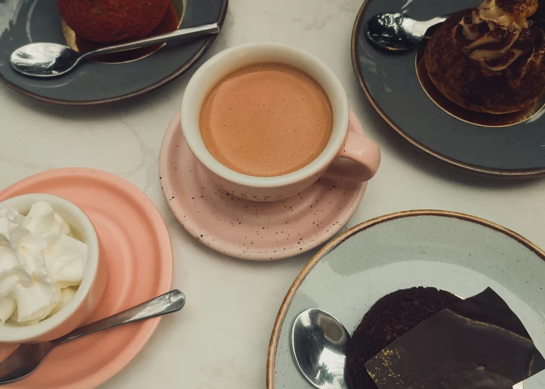 Coffee and desserts on a cafe table